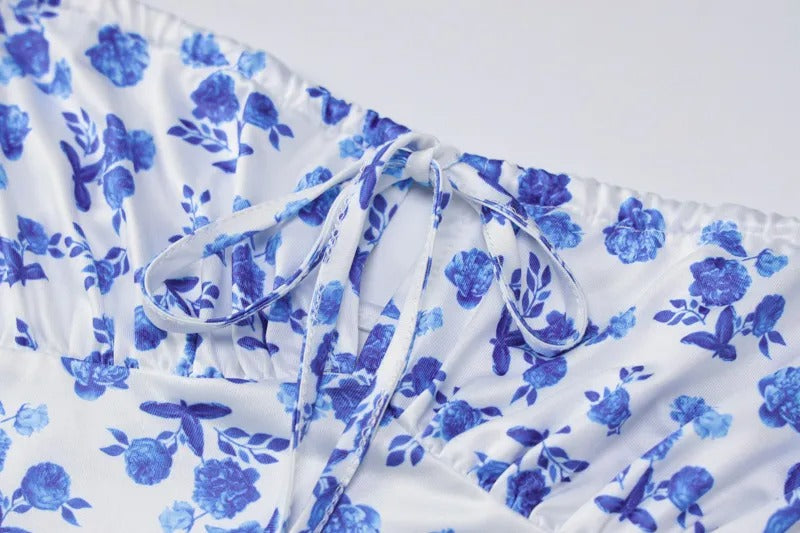 Detailed view of the tie-front bust on the Brooke Floral Maxi Dress, highlighting the ruched fabric and blue floral design.