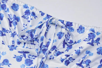 Detailed view of the tie-front bust on the Brooke Floral Maxi Dress, highlighting the ruched fabric and blue floral design.