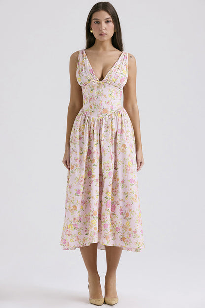 Front view of the pink Dahlia Floral Midi Dress with subtle pastel floral print, V-neck, and cinched bodice details.
