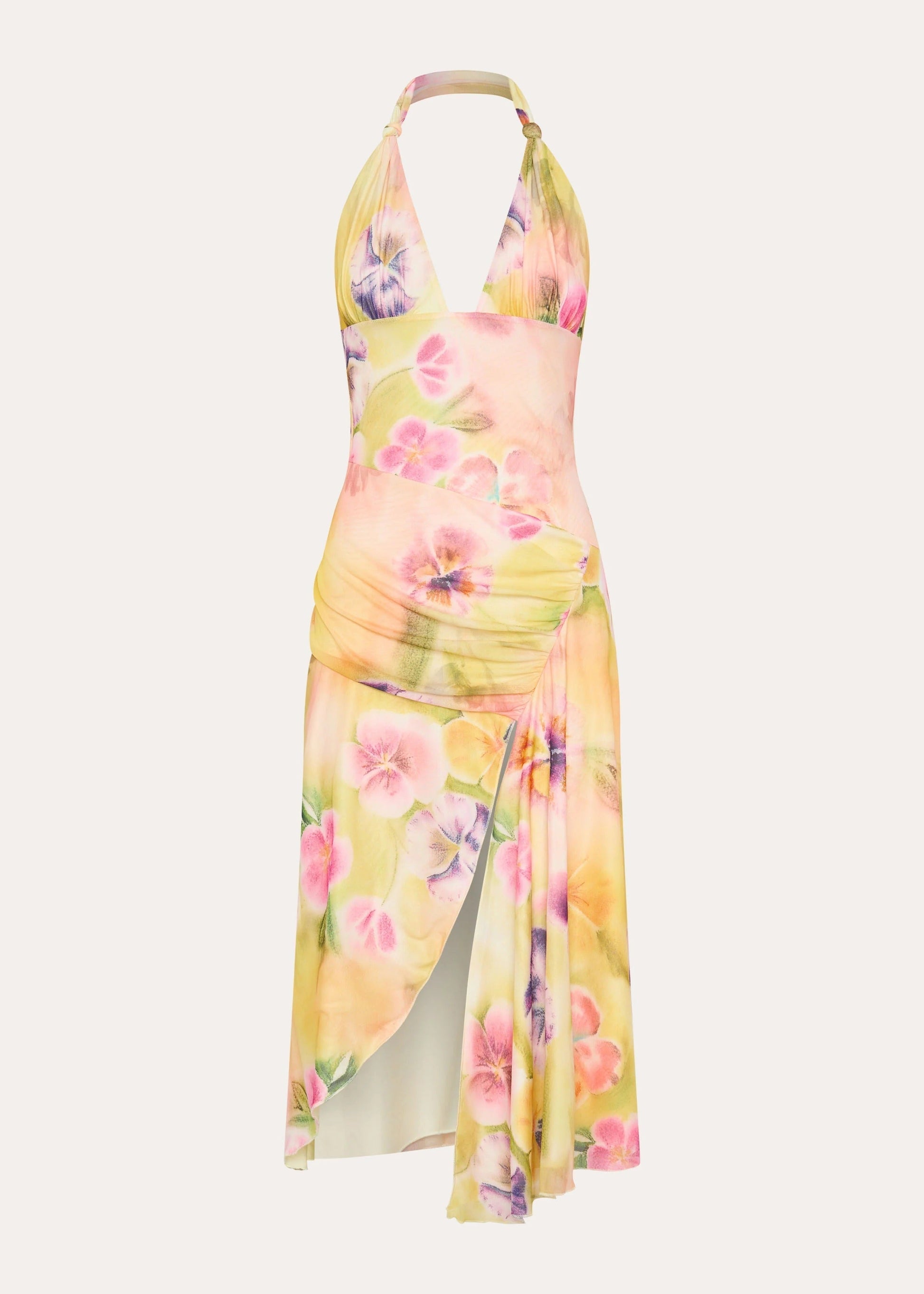 Ghost mannequin shot of the yellow, pink, and purple floral halter midi dress with ruched details and slit for women.
