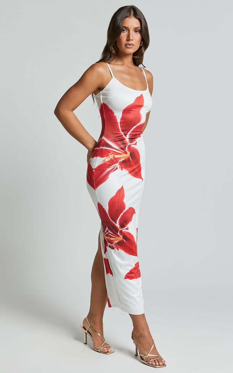 Side profile of a white Harper floral midi dress with large red lily print and thigh-high slit.