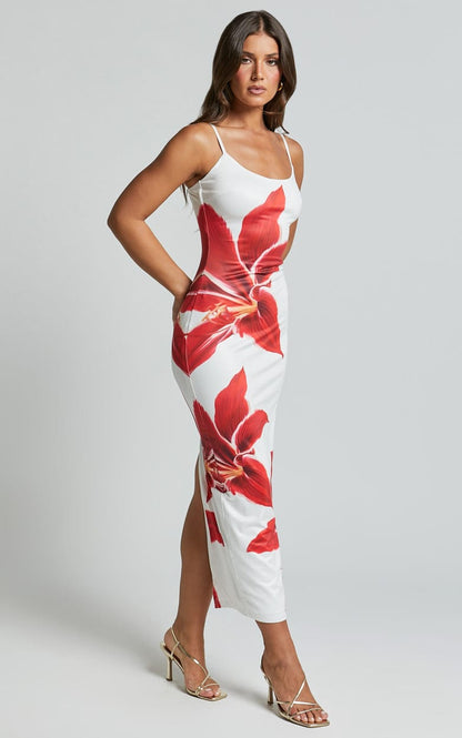 Side profile of a white Harper floral midi dress with large red lily print and thigh-high slit.