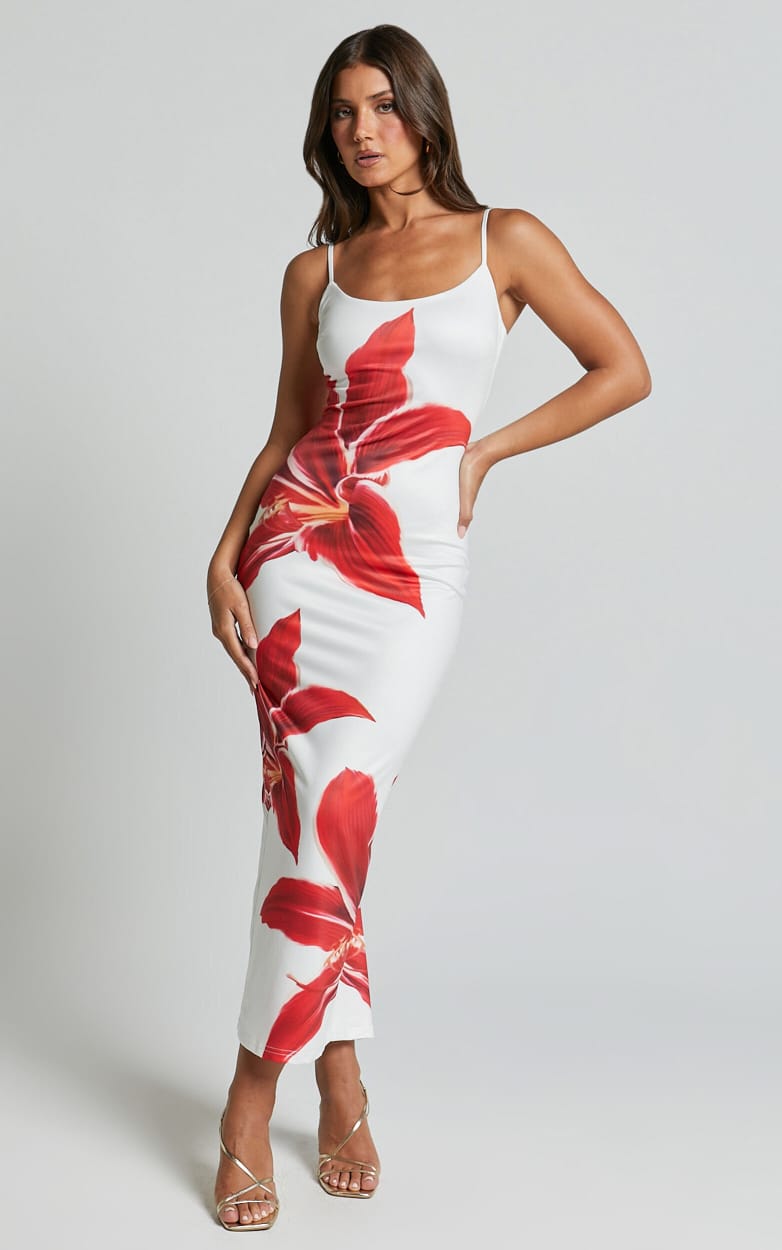 White Harper floral midi dress featuring vibrant red lily prints, a bodycon fit, and delicate straps.