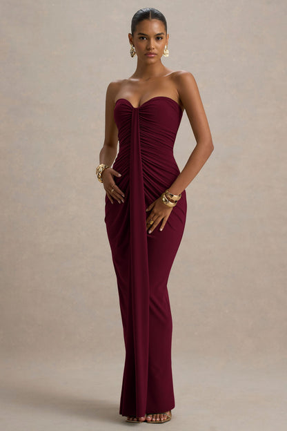 Front view of a burgundy strapless ruched maxi dress, highlighting the fitted silhouette and elegant draping.