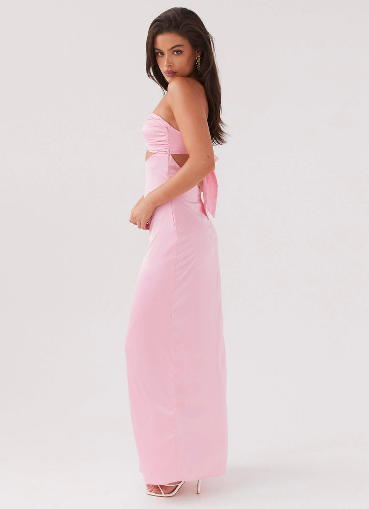 Side profile of Lyra Floral Maxi Dress in solid light pink, showing the strapless design and tie-back.