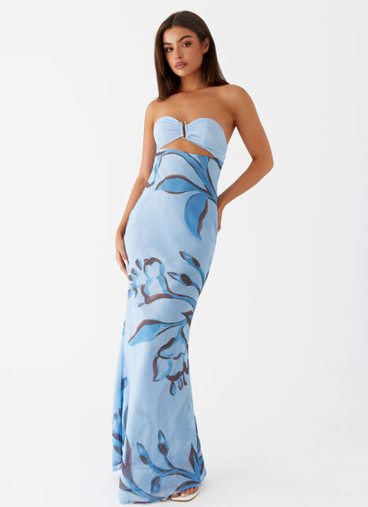 Lyra Floral Maxi Dress in light blue with dark blue abstract floral print and strapless top with silver clasp.