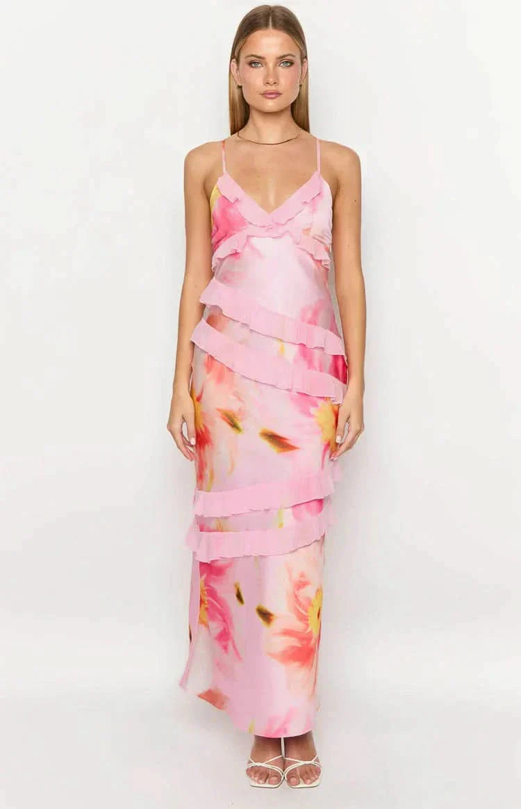 Vibrant pink floral Madeline ruffle maxi dress with a v-neck and delicate ruffled tiers, perfect for a wedding.