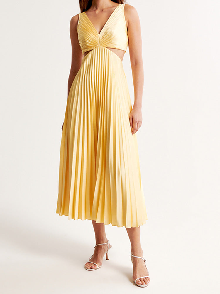 Full-length view of the Maria Pleated Maxi Dress, a light yellow dress with a V-neck, intricate pleating, and subtle side cut-outs.