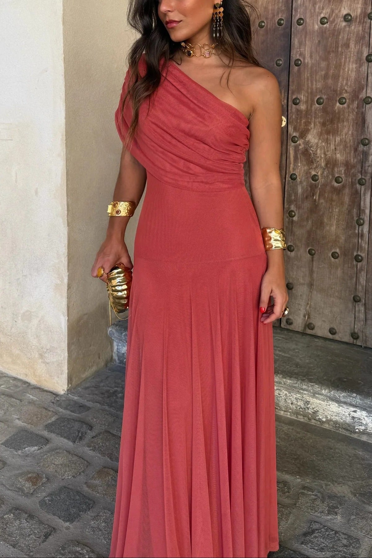 Coral Milena draped maxi dress featuring a chic one-shoulder design and a flowing silhouette.