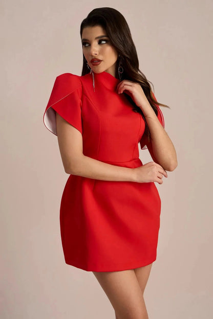 Red Nora Bow Mini Dress with short puff sleeves, high neckline, and white lining visible on the sleeves.