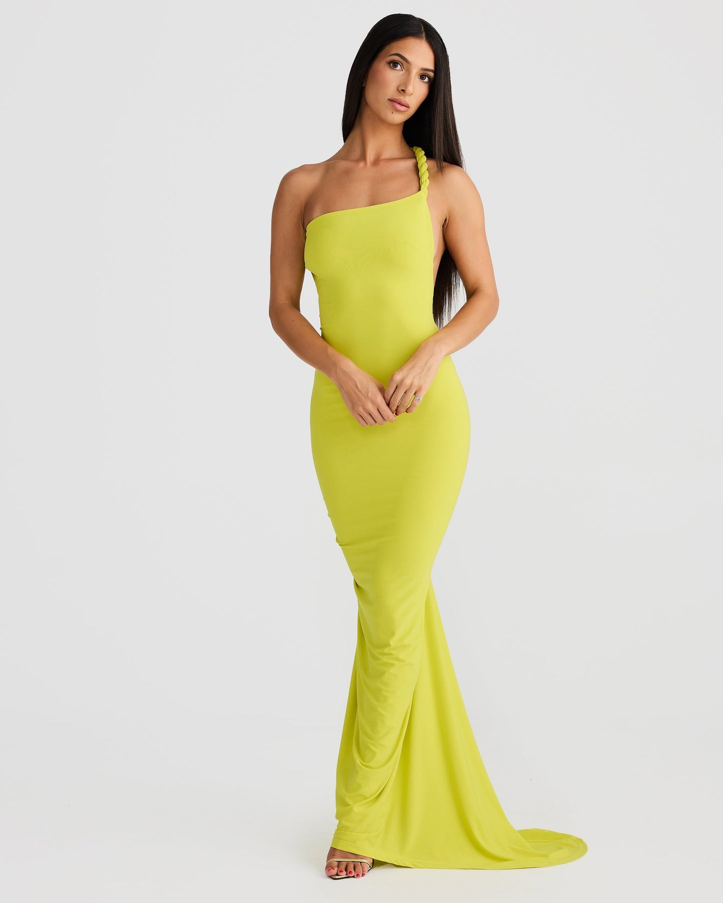 Side view of a lime green Paulina maxi dress with a one-shoulder braided strap, showcasing the sleek fit.