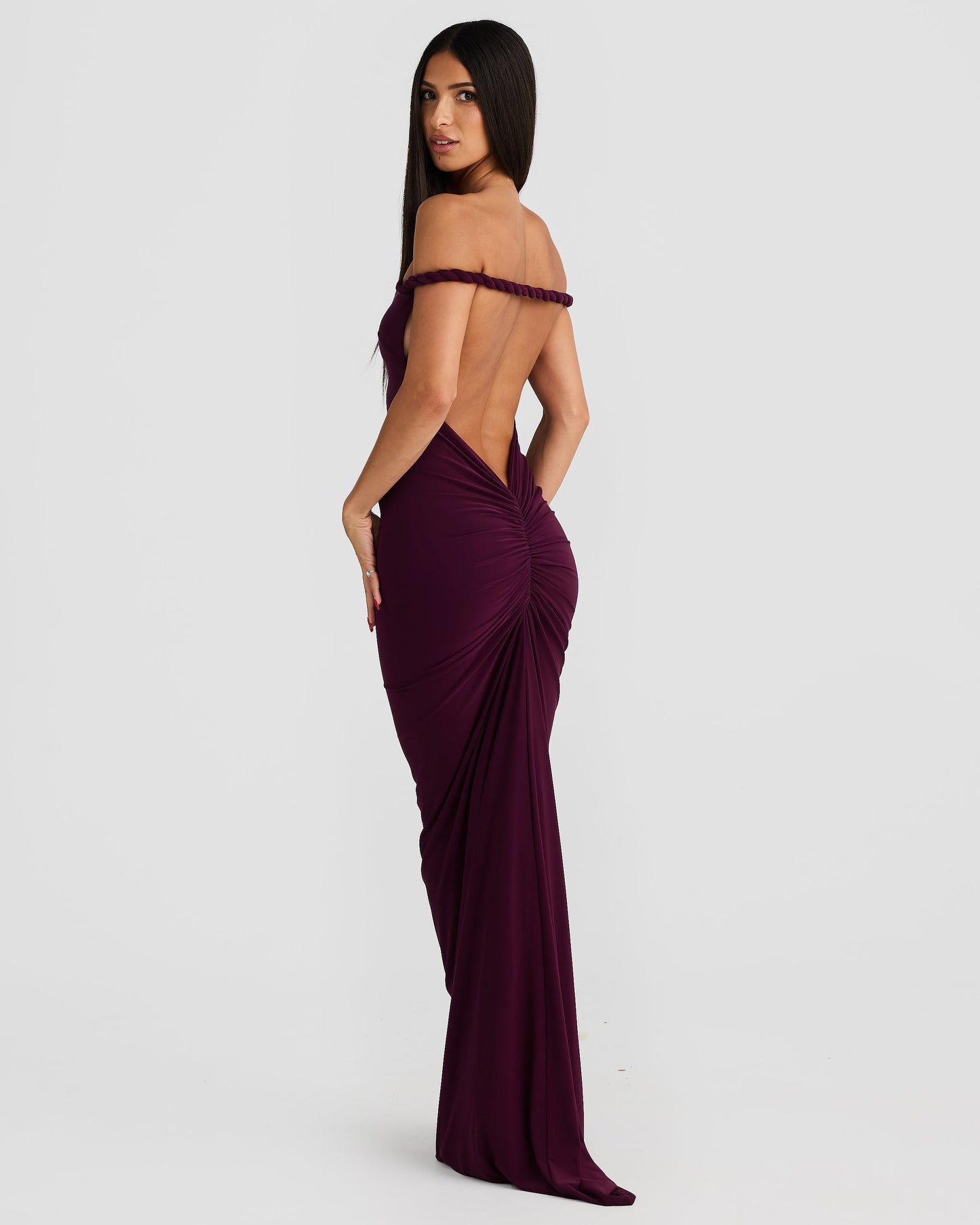 Deep plum Paulina backless maxi dress featuring braided off-shoulder straps and elegant back ruching.