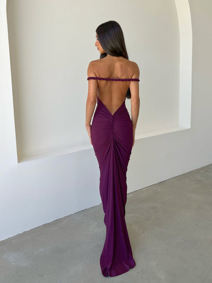 Back view of the Paulina backless maxi dress in deep plum, featuring ruched detailing and off-the-shoulder straps.