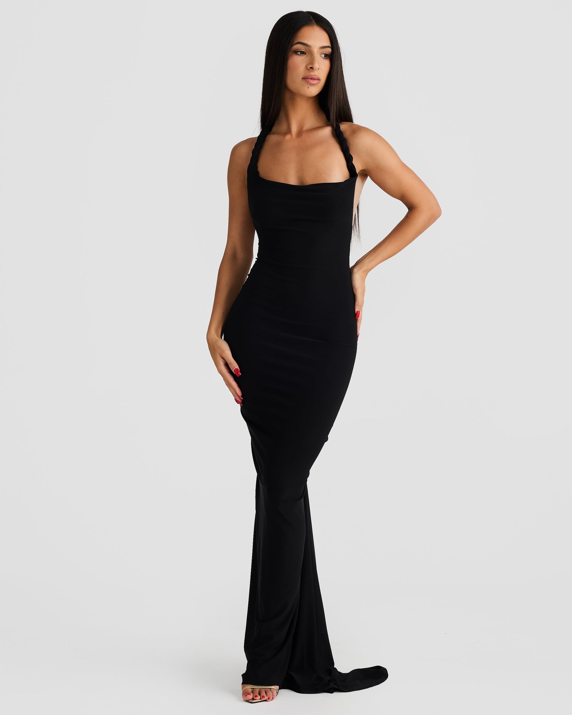 Front view of the Paulina backless maxi dress in black, with a halter neckline and form-fitting silhouette.