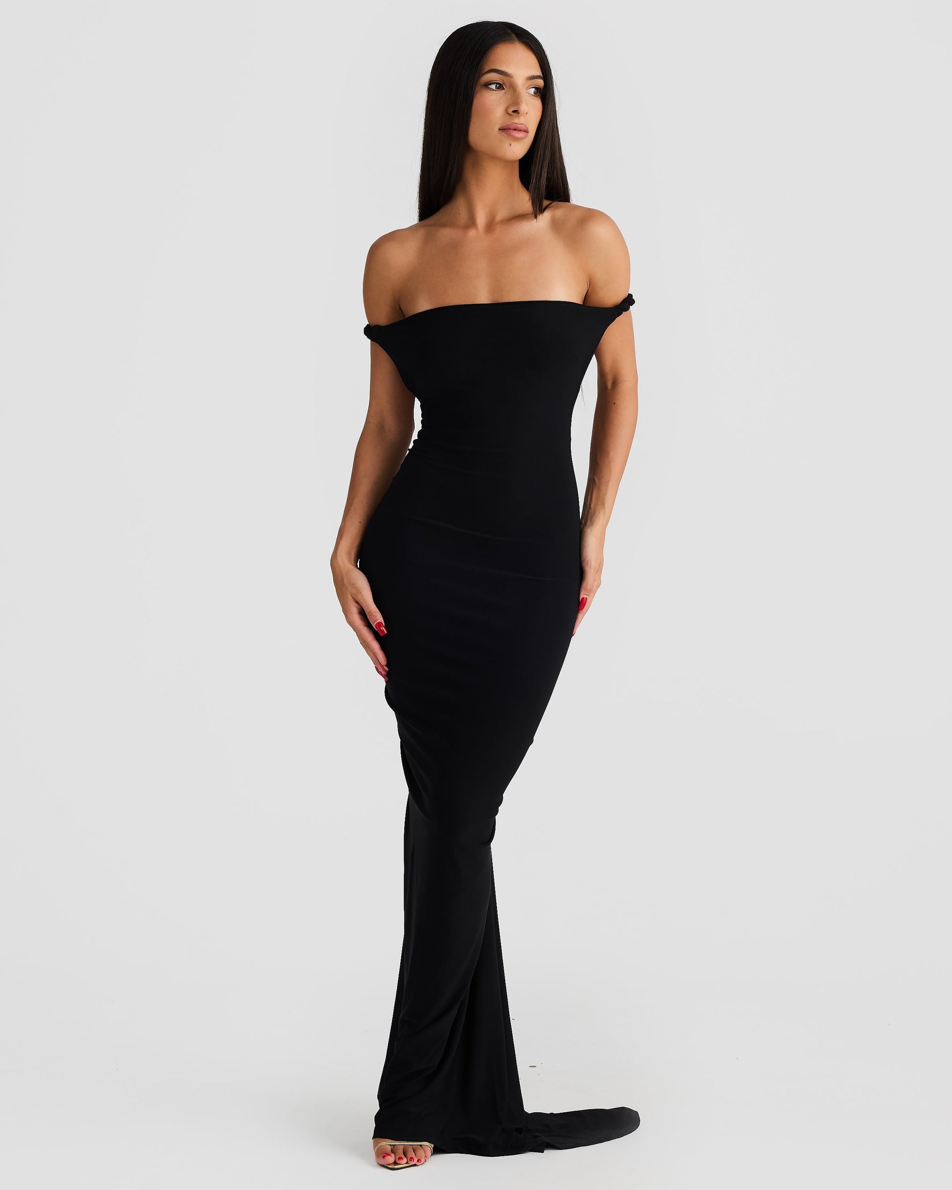 Front view of the black Paulina maxi dress, styled as an off-the-shoulder gown with a sleek, long skirt.