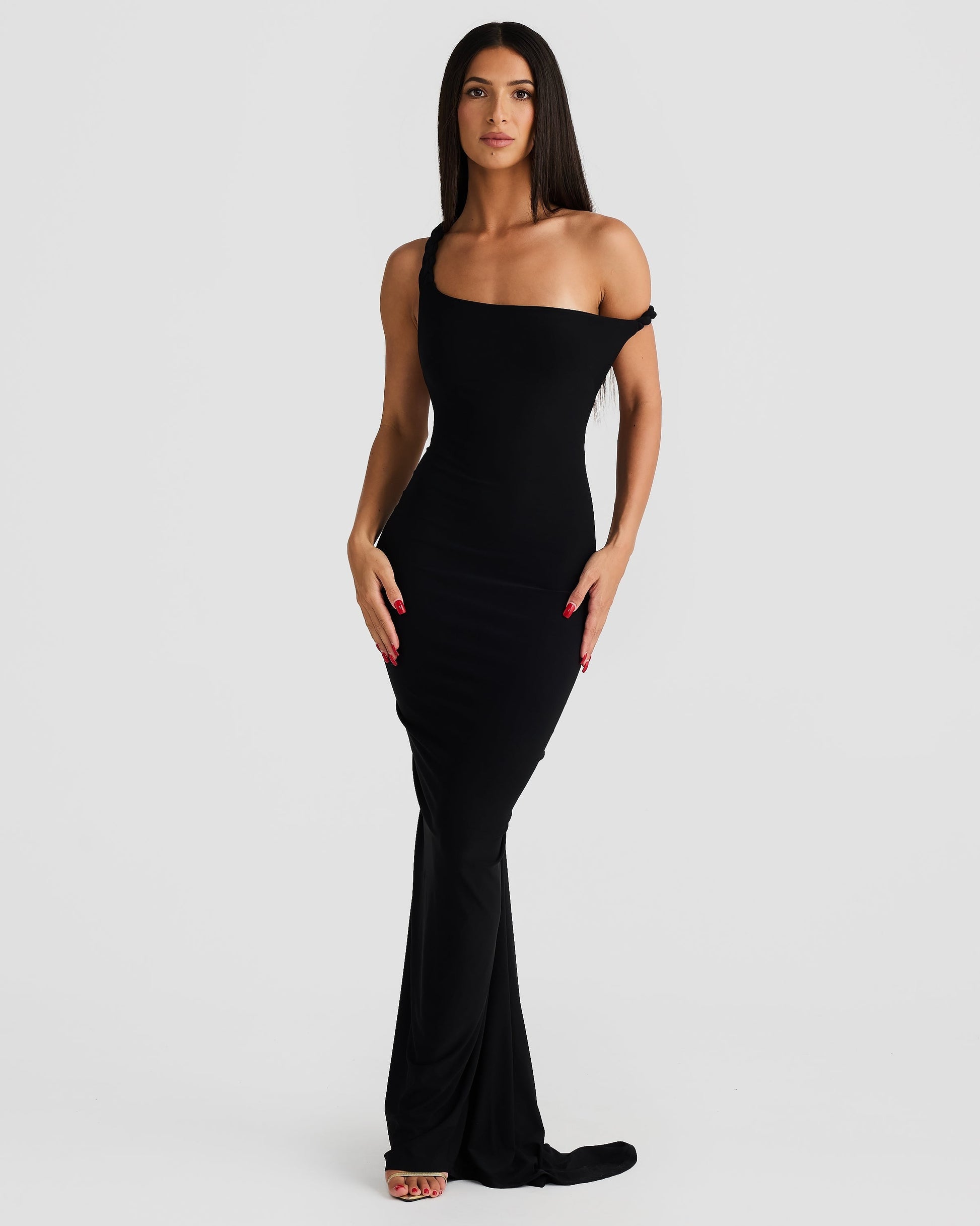 Front view of the black Paulina maxi dress, styled with one shoulder off, showcasing its versatile design.