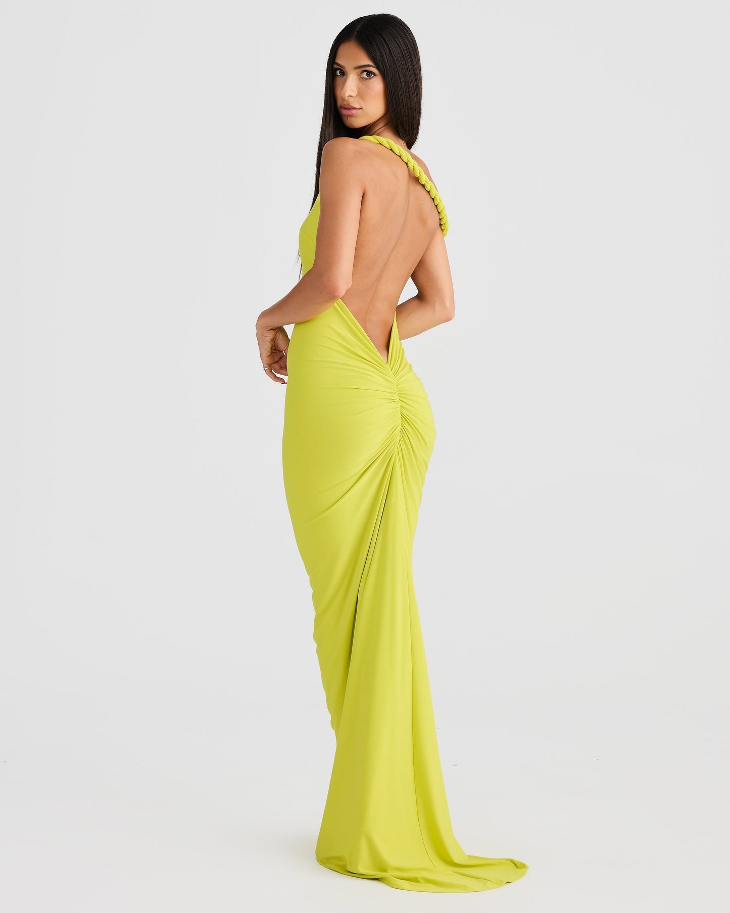 Back view of a lime green Paulina backless maxi dress with a single braided strap and elegant back ruching.