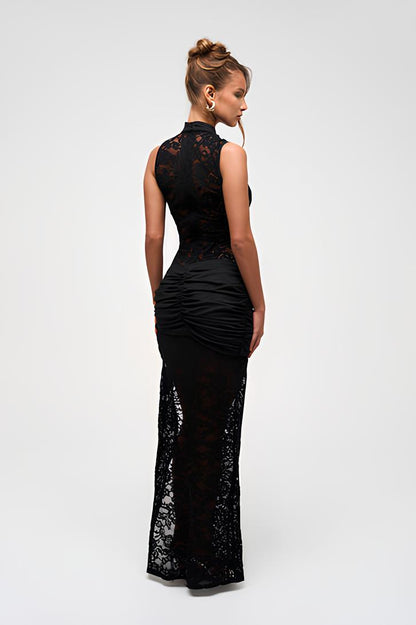 Back view of the black lace Rebecca Keyhole Maxi Dress, showing the ruched detailing on the back and sheer lace skirt.