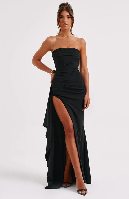 Black Rosie Ruched Maxi Dress, strapless with a high leg slit and elegant cascading fabric, front view.
