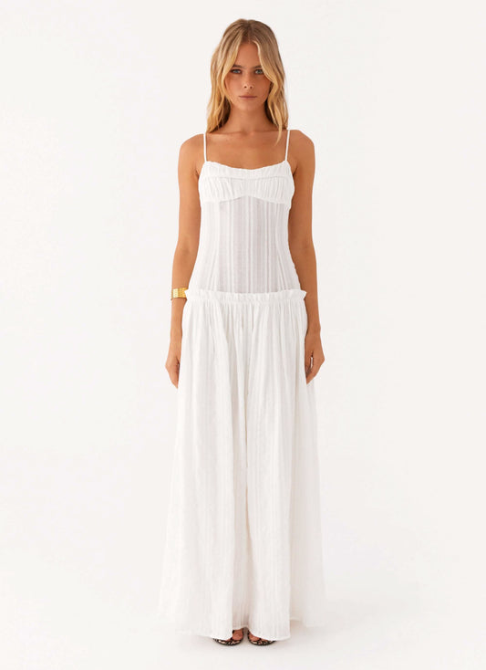 Front view of a white Sierra Ruched Maxi Dress with thin straps and a gathered bodice, flowing skirt.