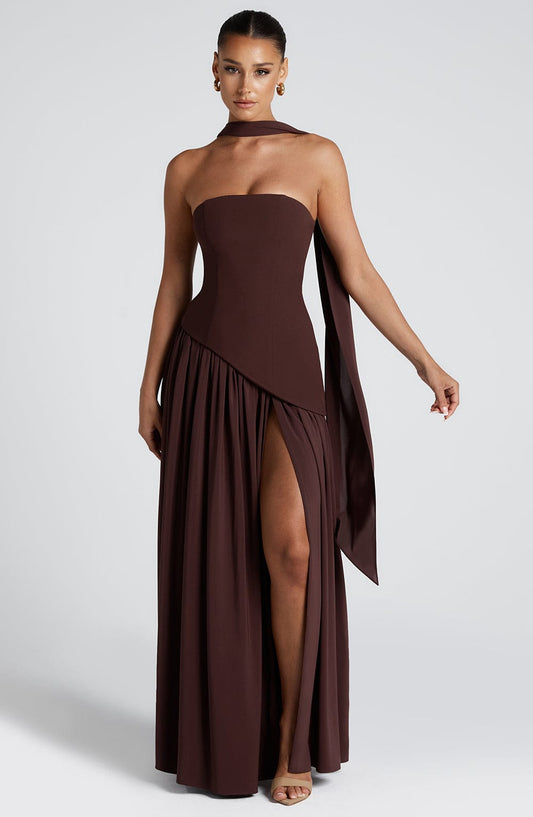 Brown strapless corset maxi dress with pleated flowing skirt and high slit — front view