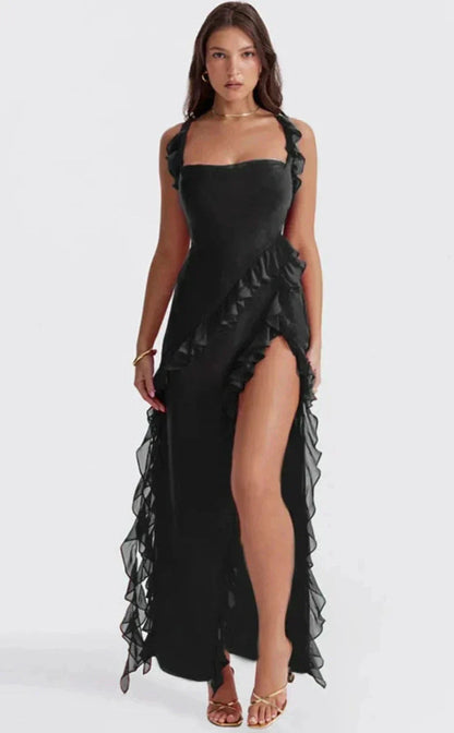 Black ruffle maxi dress with thigh-high slit — detail view showing square neckline and ruffle straps.