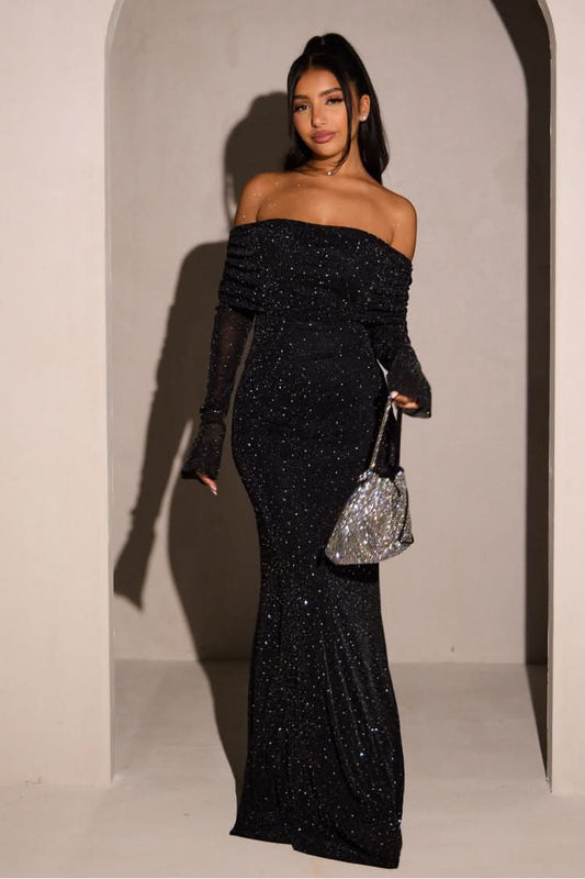 Black glitter off-shoulder maxi dress — front view showing sheer sleeves and sparkling texture