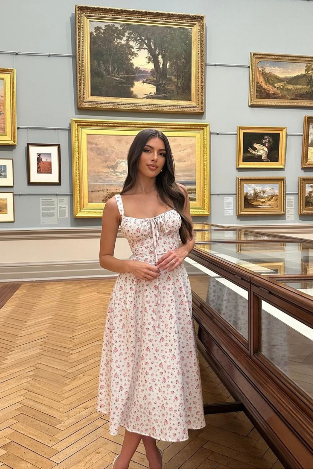 Floral midi dress styled with heels, perfect for garden parties and romantic outings.