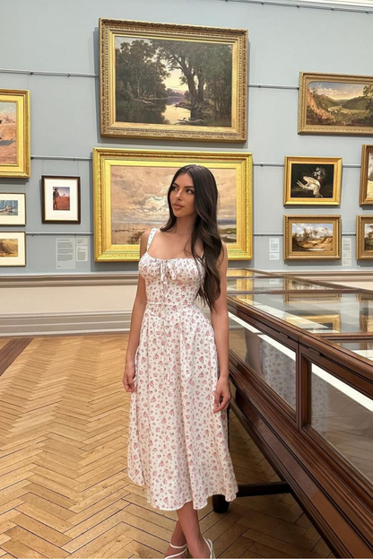 Close-up detail of corset bodice and floral print fabric with delicate design.