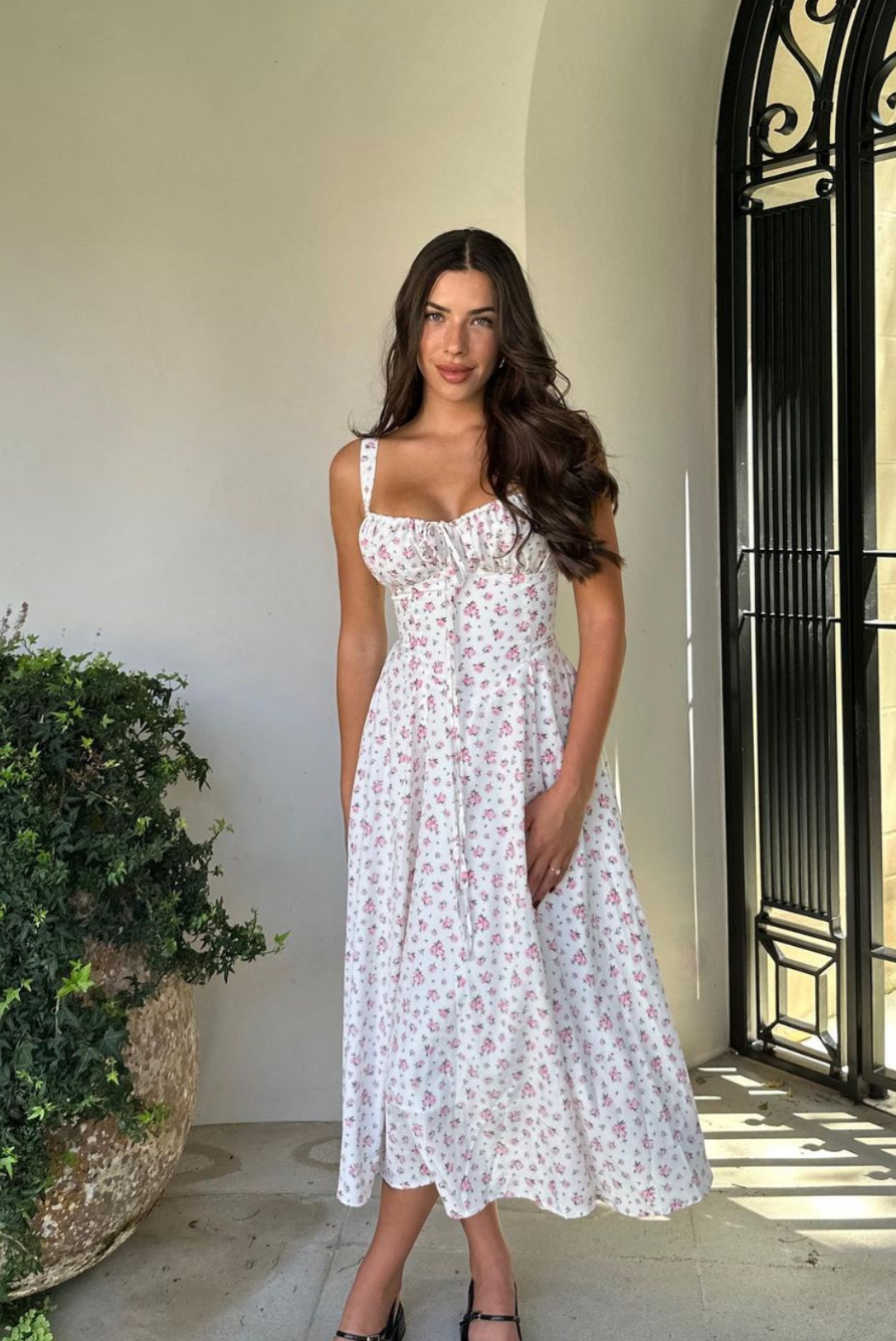 Floral midi dress with corset bodice, sweetheart neckline, and A-line skirt.