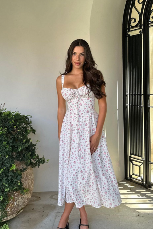 Floral midi dress with corset bodice, sweetheart neckline, and A-line skirt.