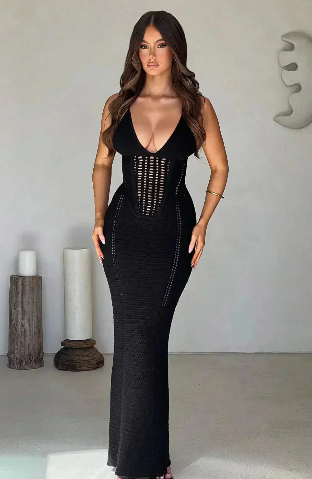 Black crochet corset maxi dress with deep V-neckline — front view highlighting waist definition